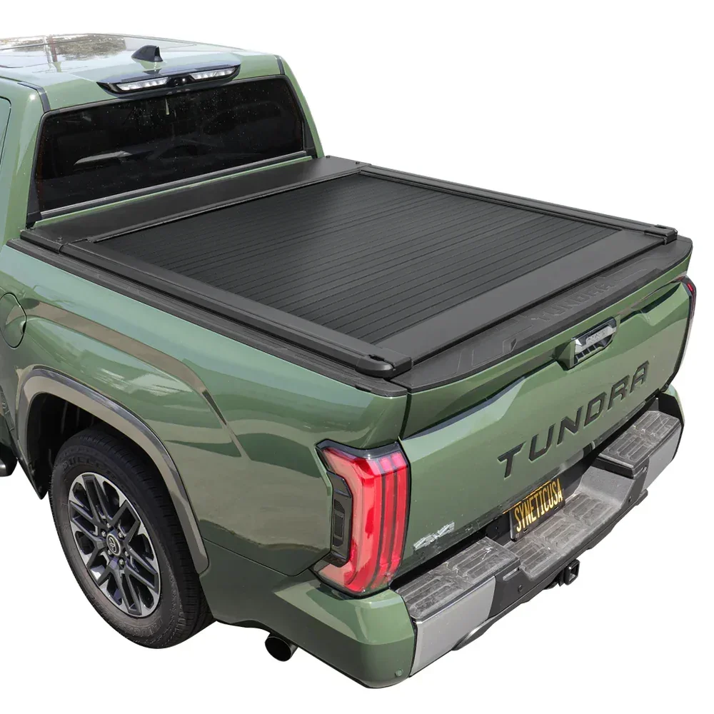 Alaska retractable tonneau cover open on a Toyota Tundra in winter